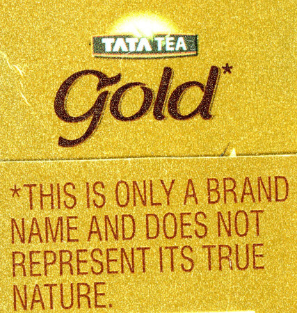 Gold box labaled Tata Tea Gold, with the note THIS IS ONLY A BRAND NAME AND DOES NOT REPRESENT ITS TRUE NATURE